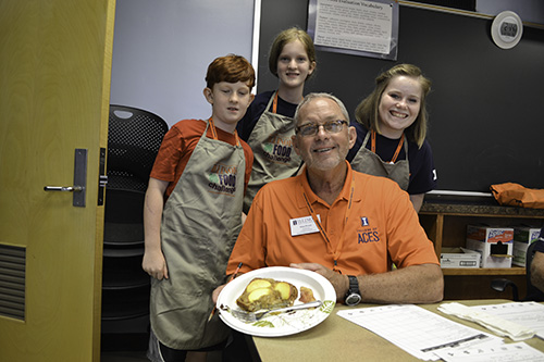 A team of students with the judge who tasted their food in the Food Challenge session.
</div>