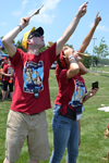 Brian Woodard and a couple of GAMES campers follow the flight of a rocket during the launch event at Dodds' Park.