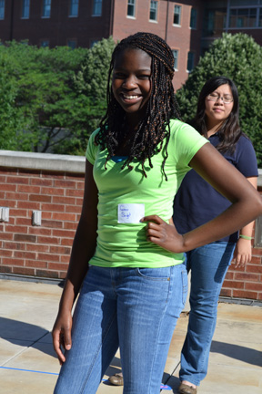 Middle school girl strikes a pose during GEMS 