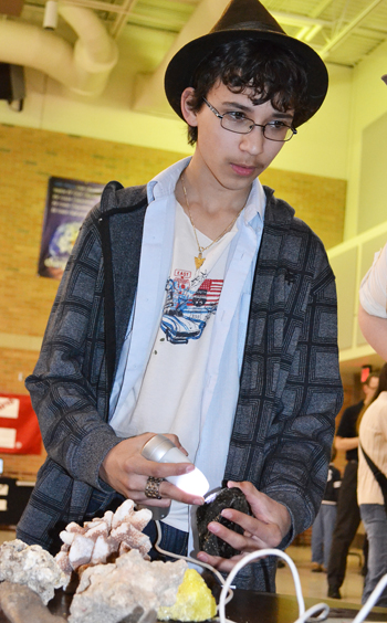 Middle school student uses the ProScope to examine Yellowstone Park artifacts.